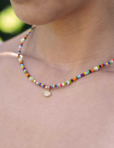 Multicolor planet necklace with seed beads, pearls, and planet charm
