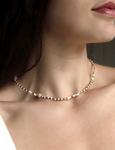 Elegant sea shell necklace with neutral sandy tones